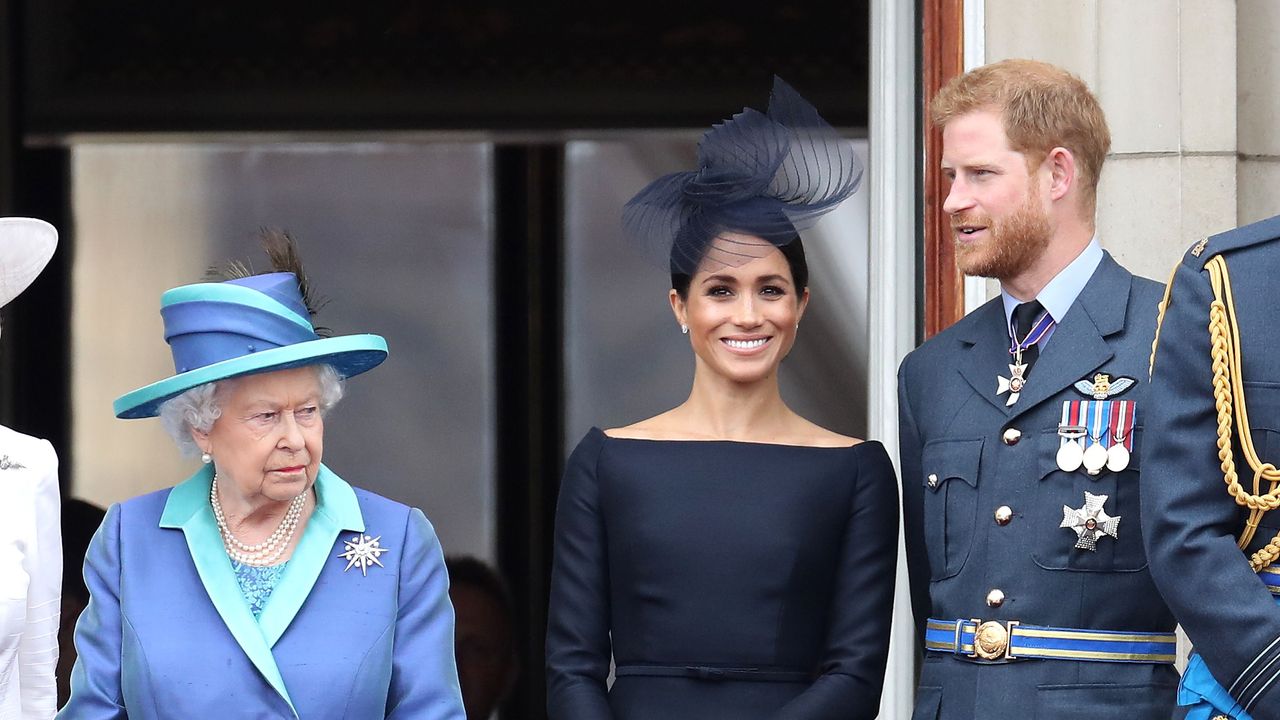 london, england july 10 queen elizabeth ii, prince harry, duke of sussex and meghan, duchess of sussex on the balcony of buckingham palace as the royal family attend events to mark the centenary of the raf on july 10, 2018 in london, england photo by chris jacksongetty images