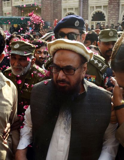 Hafiz Saeed was showered in rose petals by his supporters after being released by Pakistan.