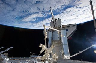 Shuttle Astronauts Haul Cargo, Get Extended Mission