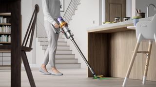 Dyson V15 Detect vacuum cleaner being used in a kitchen
