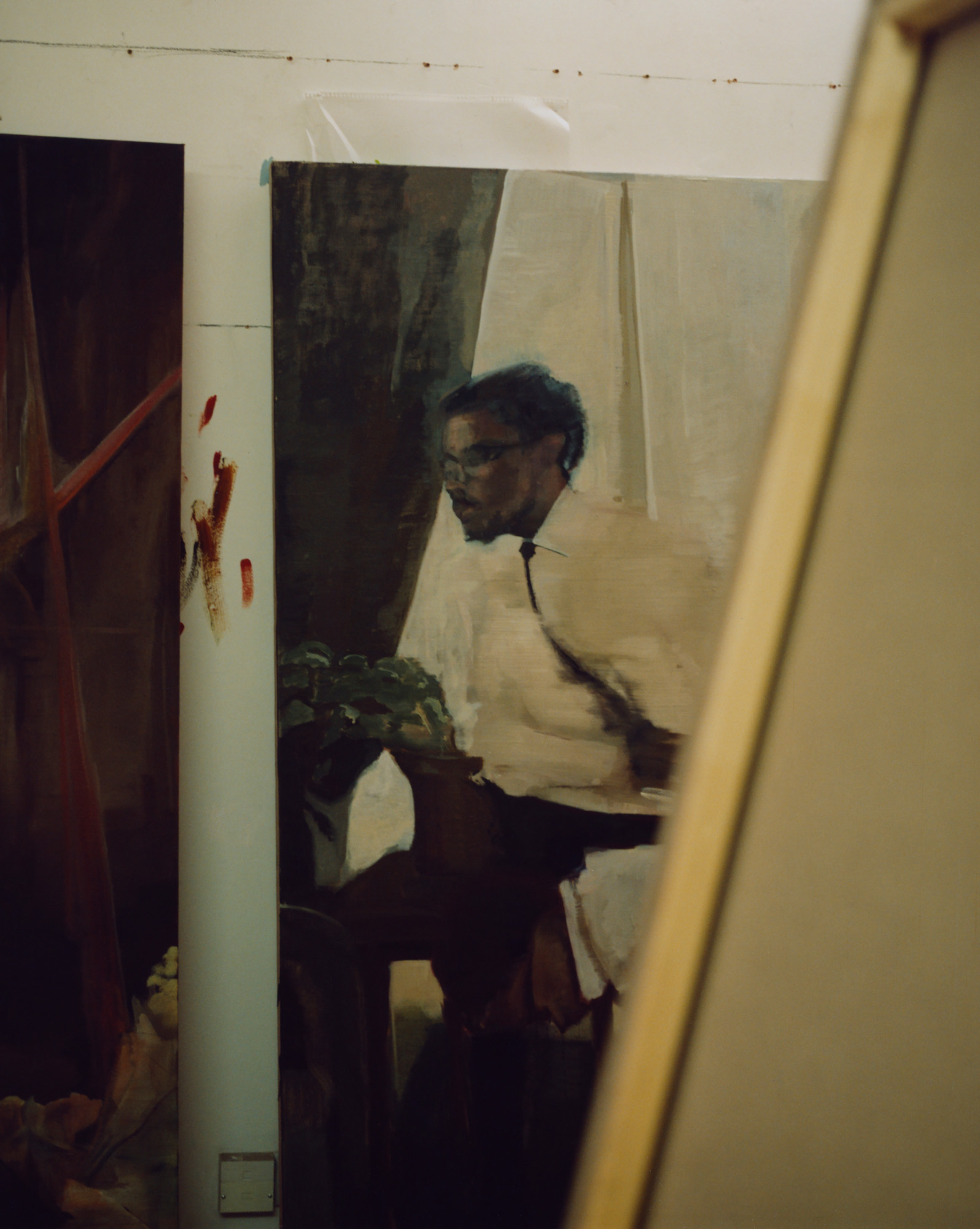 profile of artist in studio