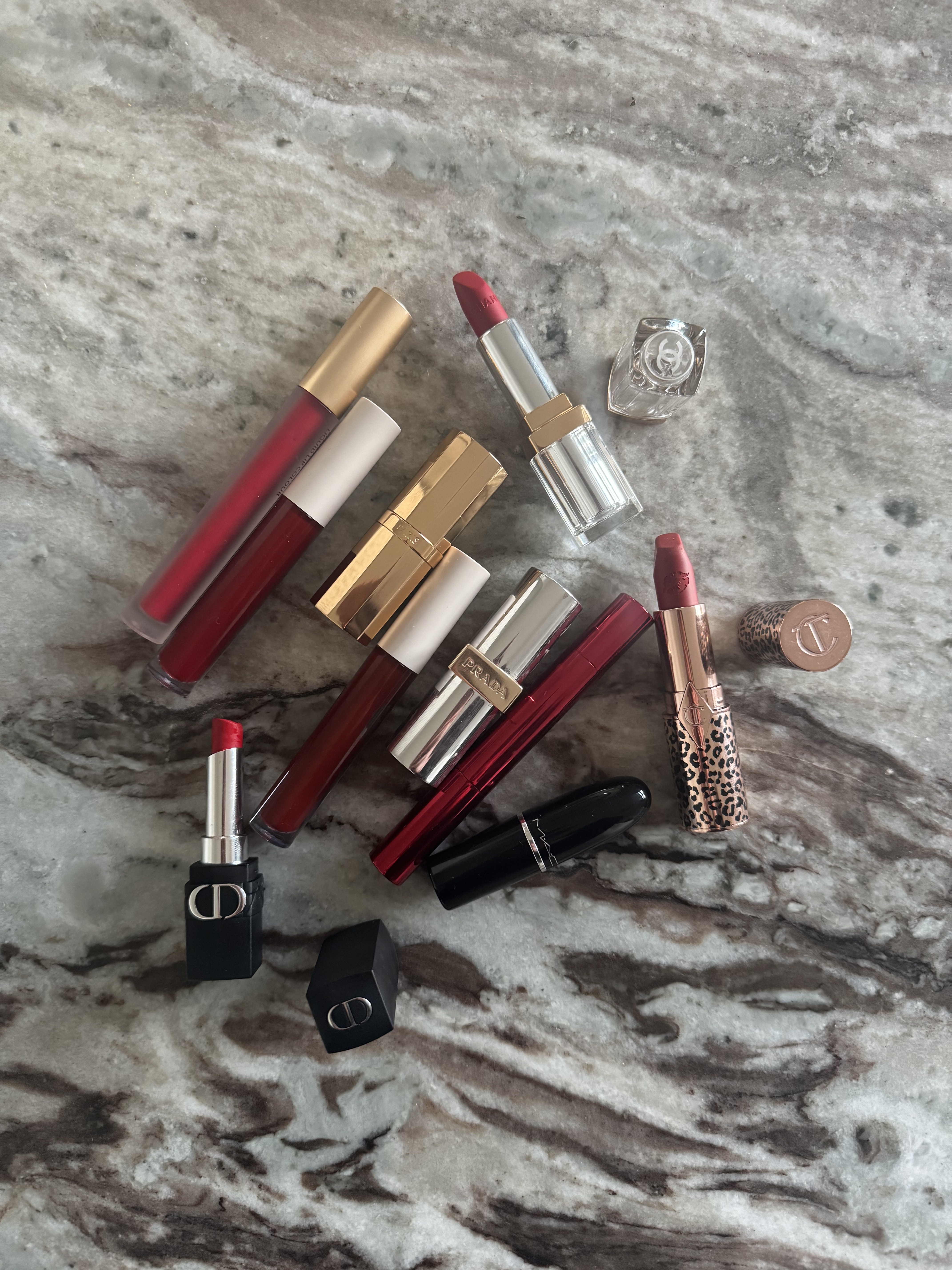 Red lipsticks on a marble table