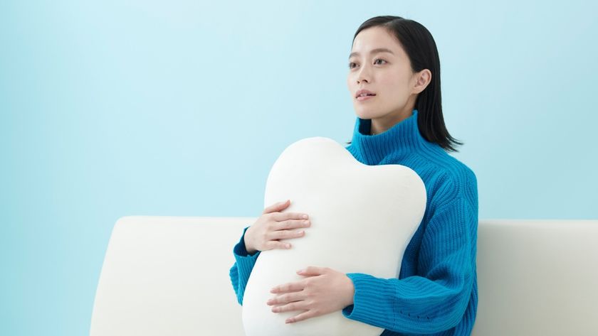 Woman holding Fufuly pillow