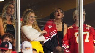 Taylor Swift watches as the Kansas City Chiefs face the Denver Broncos at GEHA Field at Arrowhead Stadium on October 12, 2023 in Kansas City, Missouri with Brittany Mahomes and Ed Kelce.