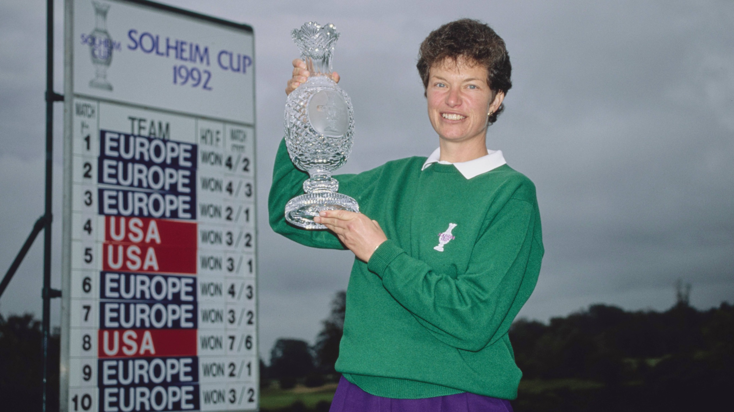 European Captain Mickey Walker holds the trophy aloft at the 1992 Solheim Cup