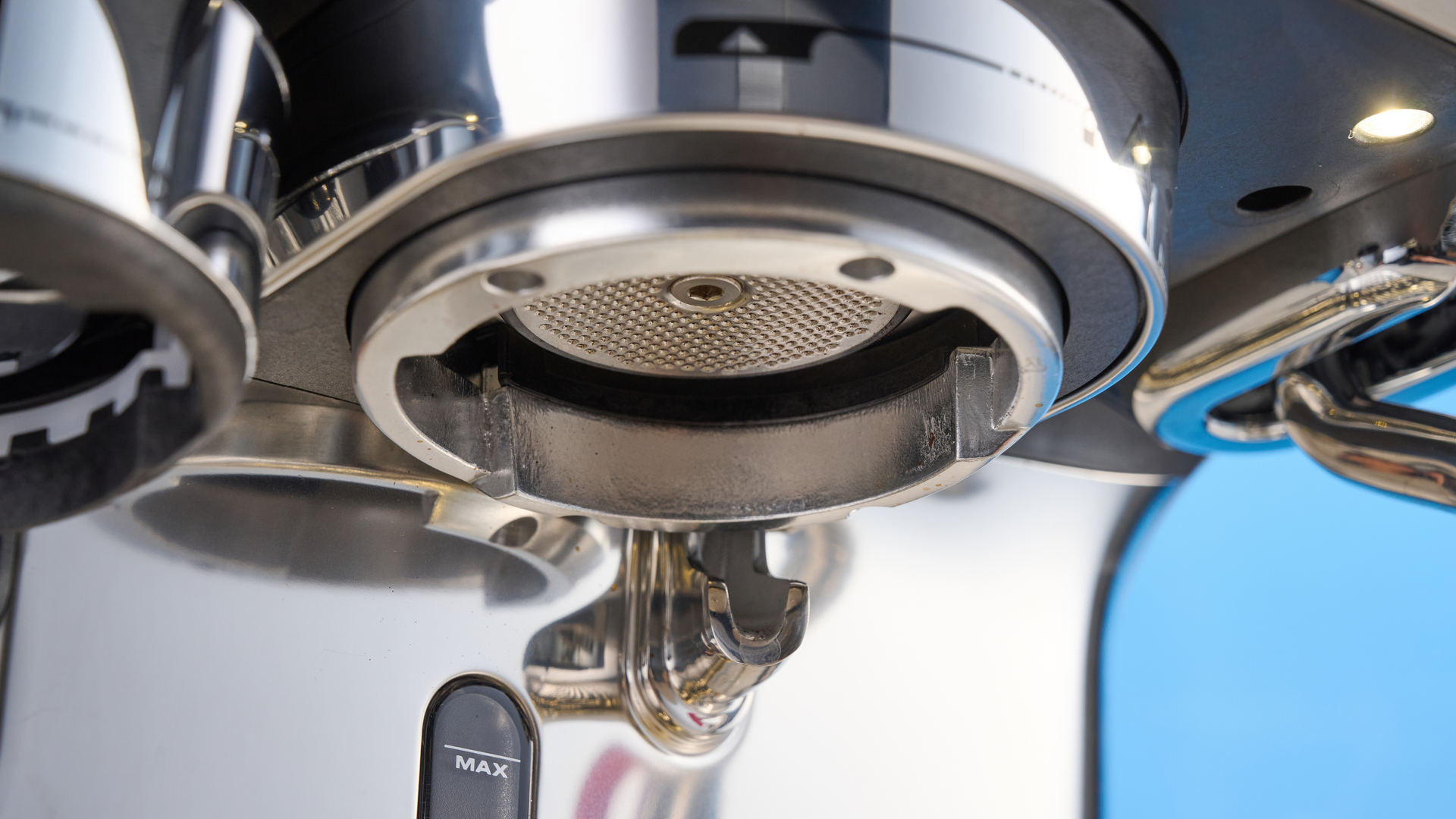 the breville oracle dual boiler / sage oracle dual boiler in stainless steel, showing its touchscreen, steam wand, built in grinder, and espresso shots