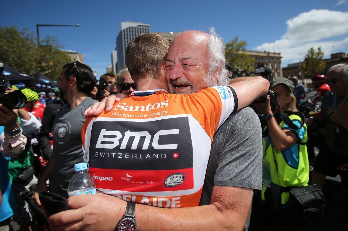 Rohan Dennis shares a hug with BMC boss Andy Rihs