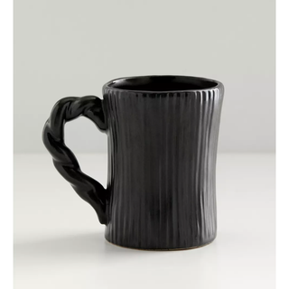 black mug with ridged design and twisted handle