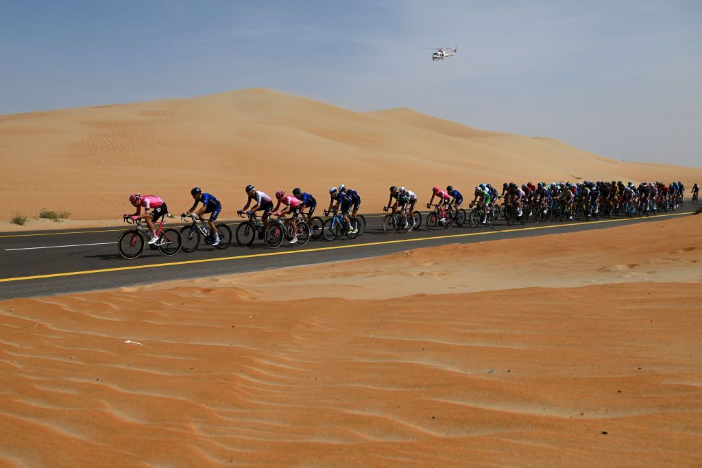 AL MIRFA UNITED ARAB EMIRATES FEBRUARY 20 A general view of the peloton passing through a landscape in the desert rduring the 5th UAE Tour 2023 Stage 1 a 151km stage from Al Dhafra Castle to Al Mirfa UAETour on February 20 2023 in Al Mirfa United Arab Emirates Photo by Dario BelingheriGetty Images