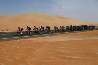 AL MIRFA UNITED ARAB EMIRATES FEBRUARY 20 A general view of the peloton passing through a landscape in the desert rduring the 5th UAE Tour 2023 Stage 1 a 151km stage from Al Dhafra Castle to Al Mirfa UAETour on February 20 2023 in Al Mirfa United Arab Emirates Photo by Dario BelingheriGetty Images