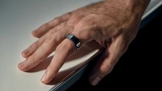 Oura Ring in black on male hand