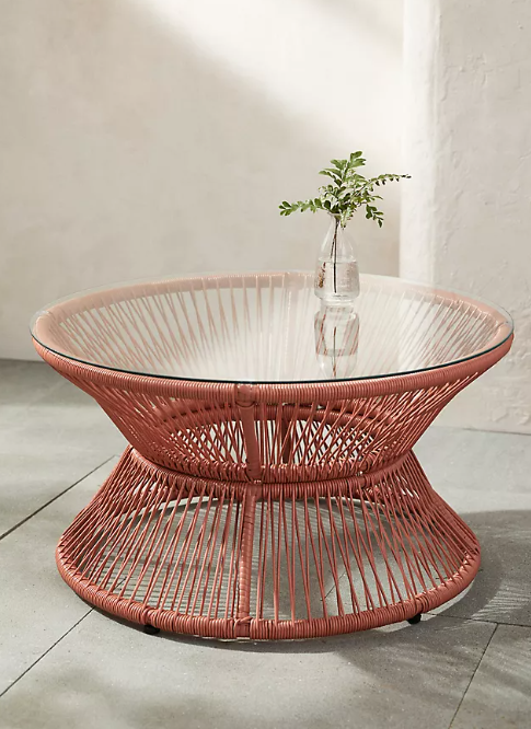 Outdoor coffee table with glass top.