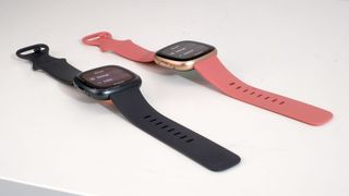 Fitbit Sense 2 and Versa 4 laid next to each other