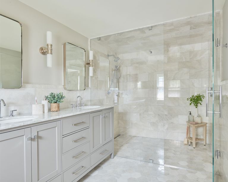 luxurious white bathroom with twin vanity and large walk-in wet room style shower