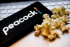 Peacock logo on a cell phone screen