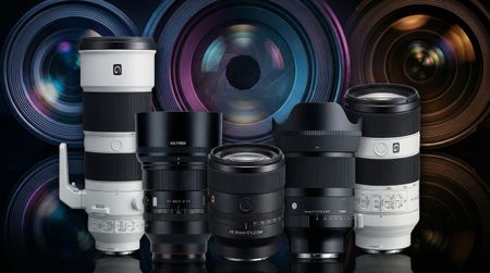 Five E-mount lenses for Sony cameras side by side, with a vibrant generated background of front lens elements