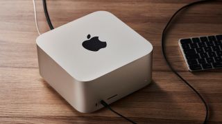 An Apple Mac Studio on a wooden desk