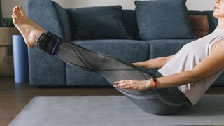 Woman doing Pilates with ankle weights