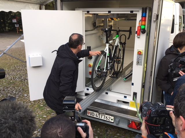 A UCI tech loads a bike into the new X-ray cabinet