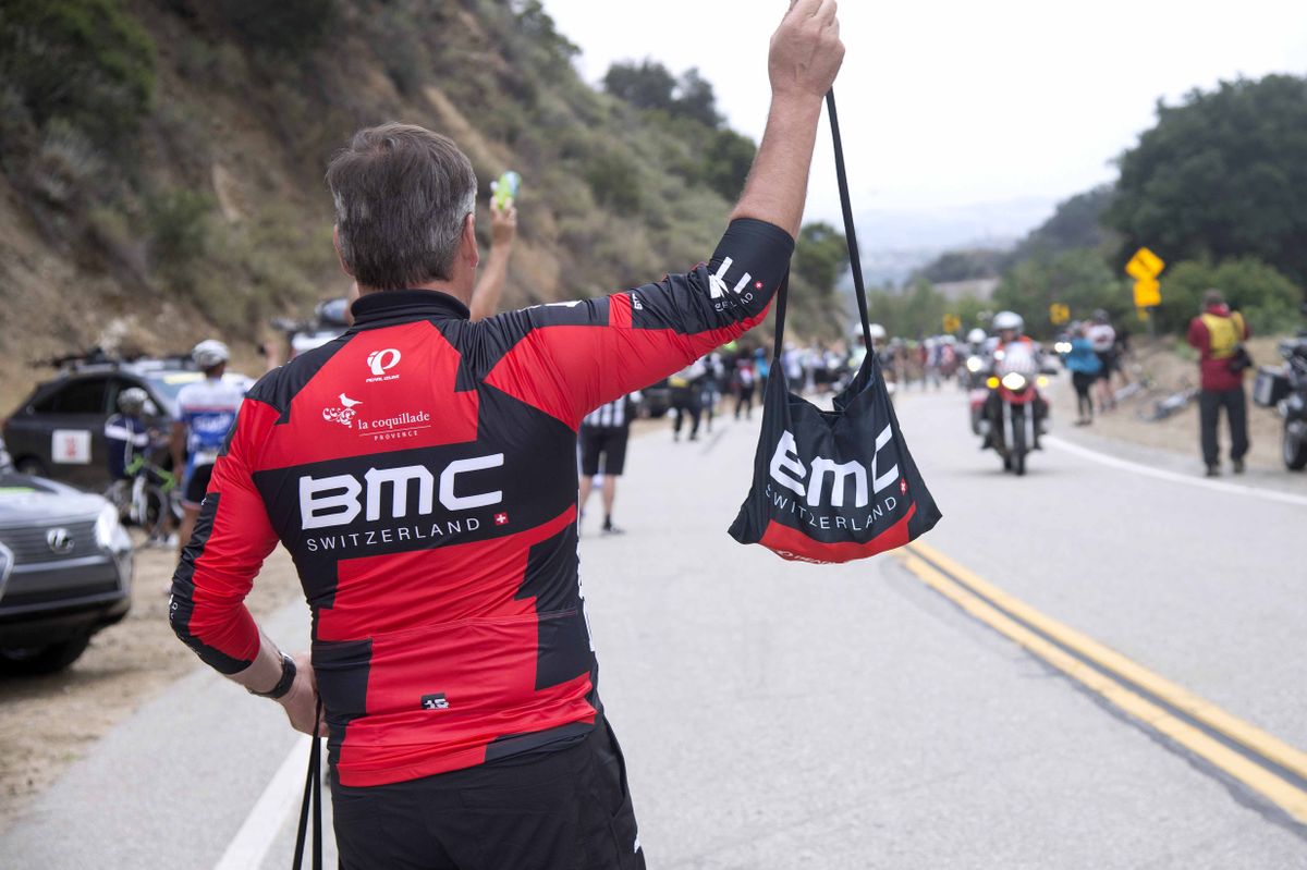 A BMC soigneur in the feed zone