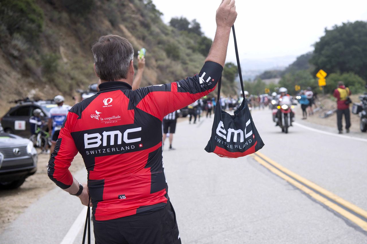 A BMC soigneur in the feed zone