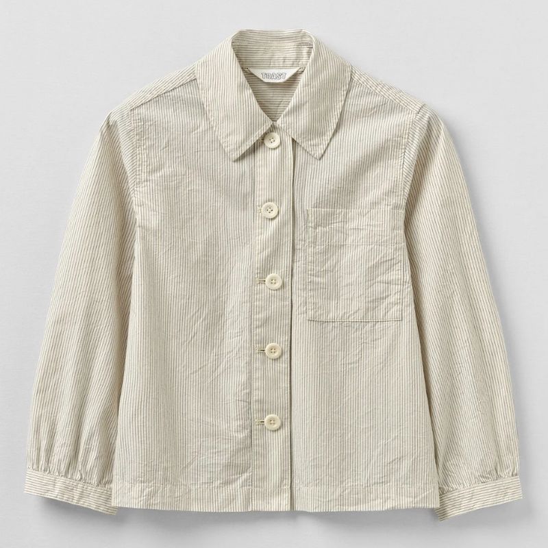 A cutout shot of a cream and striped shirt by Toast