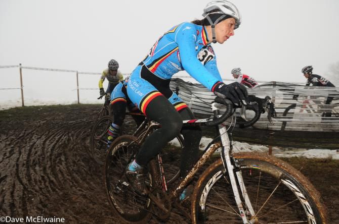 Elicia Hildenbrand (Team Rambuski Law) rounding a muddy turn on lap one