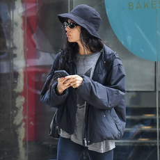 Zoe Kravitz is spotted out for a stroll in New York City. The American actress wore a black bucket hat, matching jacket, grey shirt, black leggings, and matching flats.