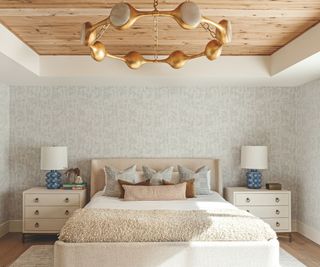 bedroom with statement pendant light and wooden ceiling