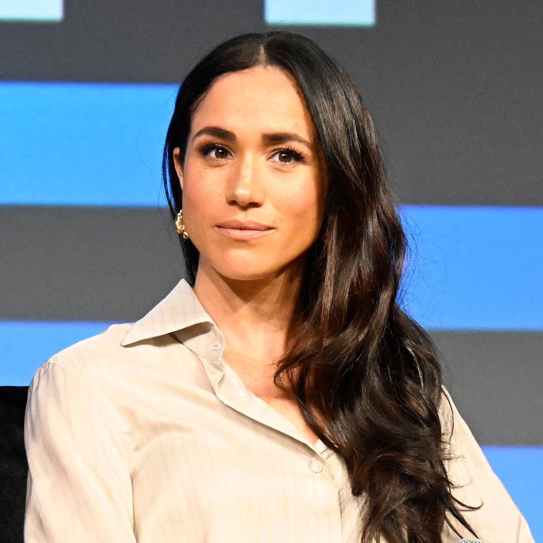 Meghan Markle wears a cream shirt