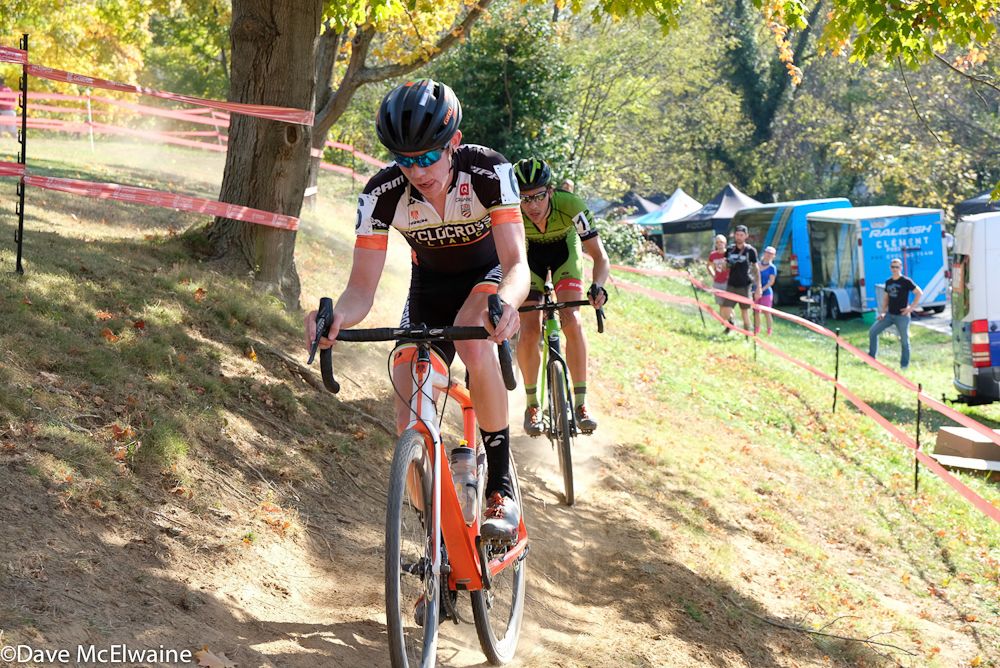 Spencer Petrov (Cyclocross Collective) leading Curtis White on an off-camber section of the course.