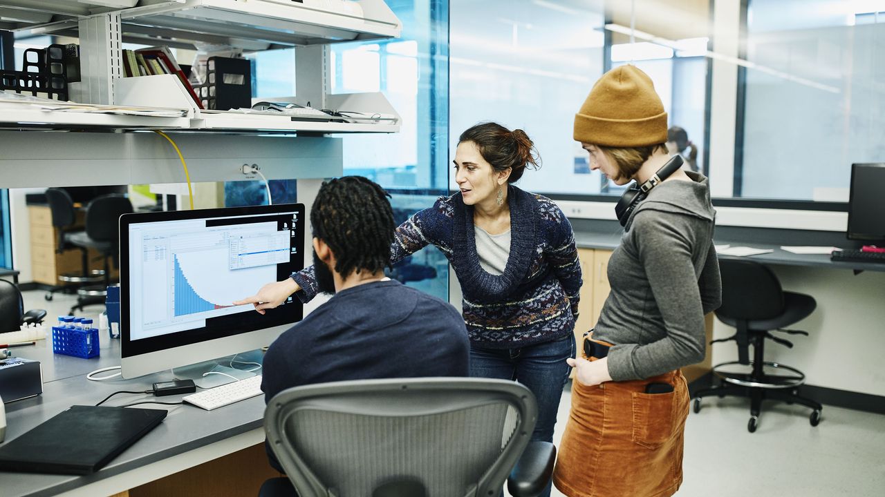 group of people analyzing research