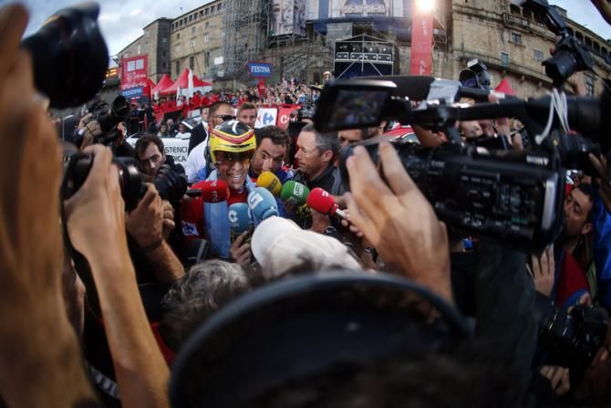 Alberto Contador (Tinkoff-Saxo) mobbed by the press after winning the 2014 Vuelta a Espa&ntilde;a