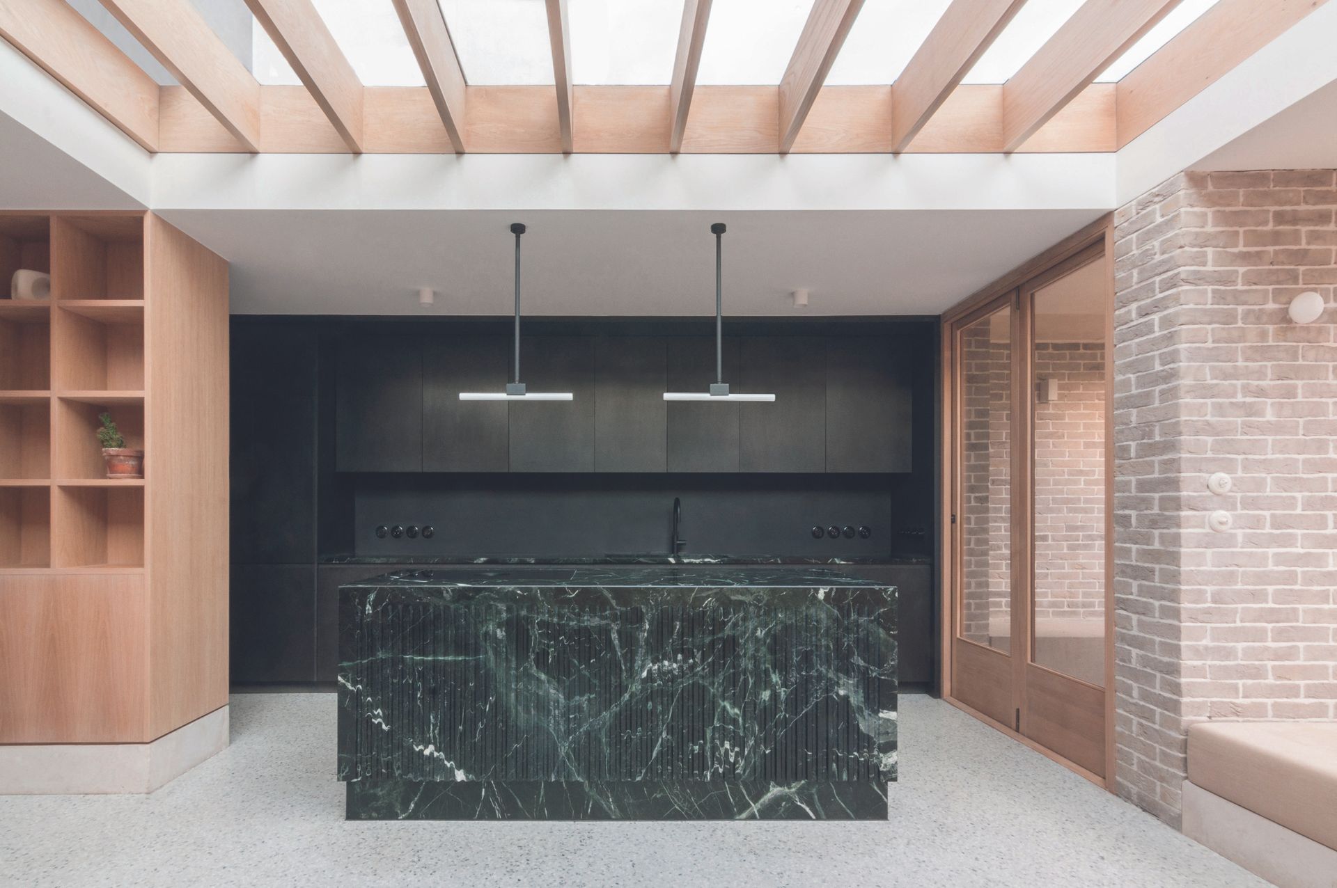 A kitchen with a stone island
