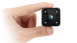 Hand holding Fredi Mini Hidden Camera,