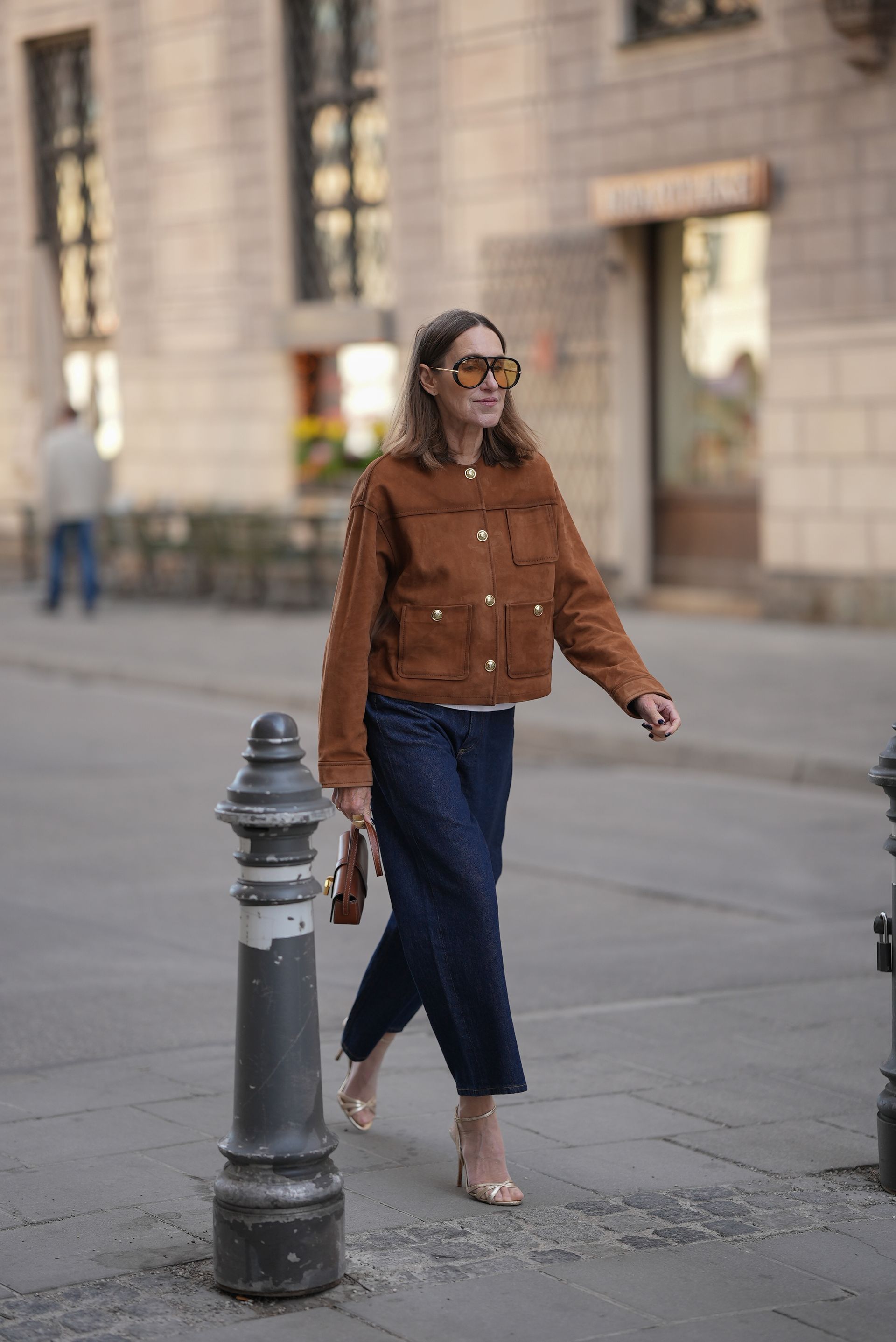 Influencer wears gold heels.