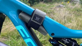 Peaty’s Holdfast Trail Tool Wrap attached to a bike frame