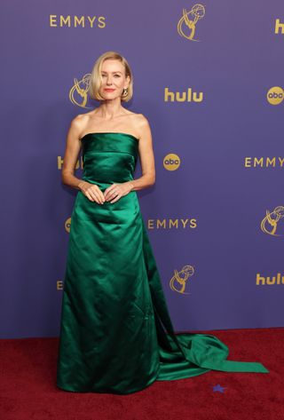 Naomi Watts wears a green strapless Balenciaga gown.