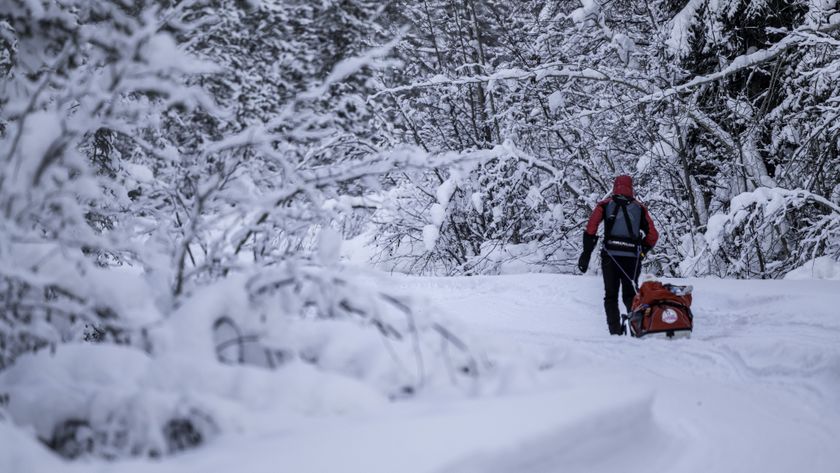 An ultra runner pulls a sled in the snow in the Montane Yukon Arctic race 2025