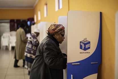 A South African woman at the voting box. 
