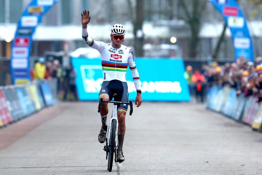 Dutch Mathieu Van Der Poel celebrates as he crosses the finish line to win the men's elite race of Herentals, a stage of the X&Acirc;&sup2;O Badkamers Trophy, in Herentals, on December 16, 2023. (Photo by DAVID PINTENS / Belga / AFP) / Belgium OUT