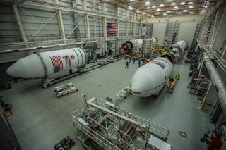 Northrop Grumman's Antares rocket, preparing for Northrop Grumman's 10th commercial resupply mission to the International Space Station, is seen on the left in the Horizontal Integration Facility at NASA's Wallops Flight Facility in Virginia.