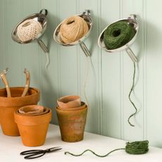 garden pots with threads on white cupboard