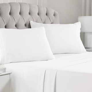 White Mellanni Queen Sheet Set on a bed