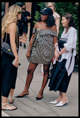 Three girls outside fashion week