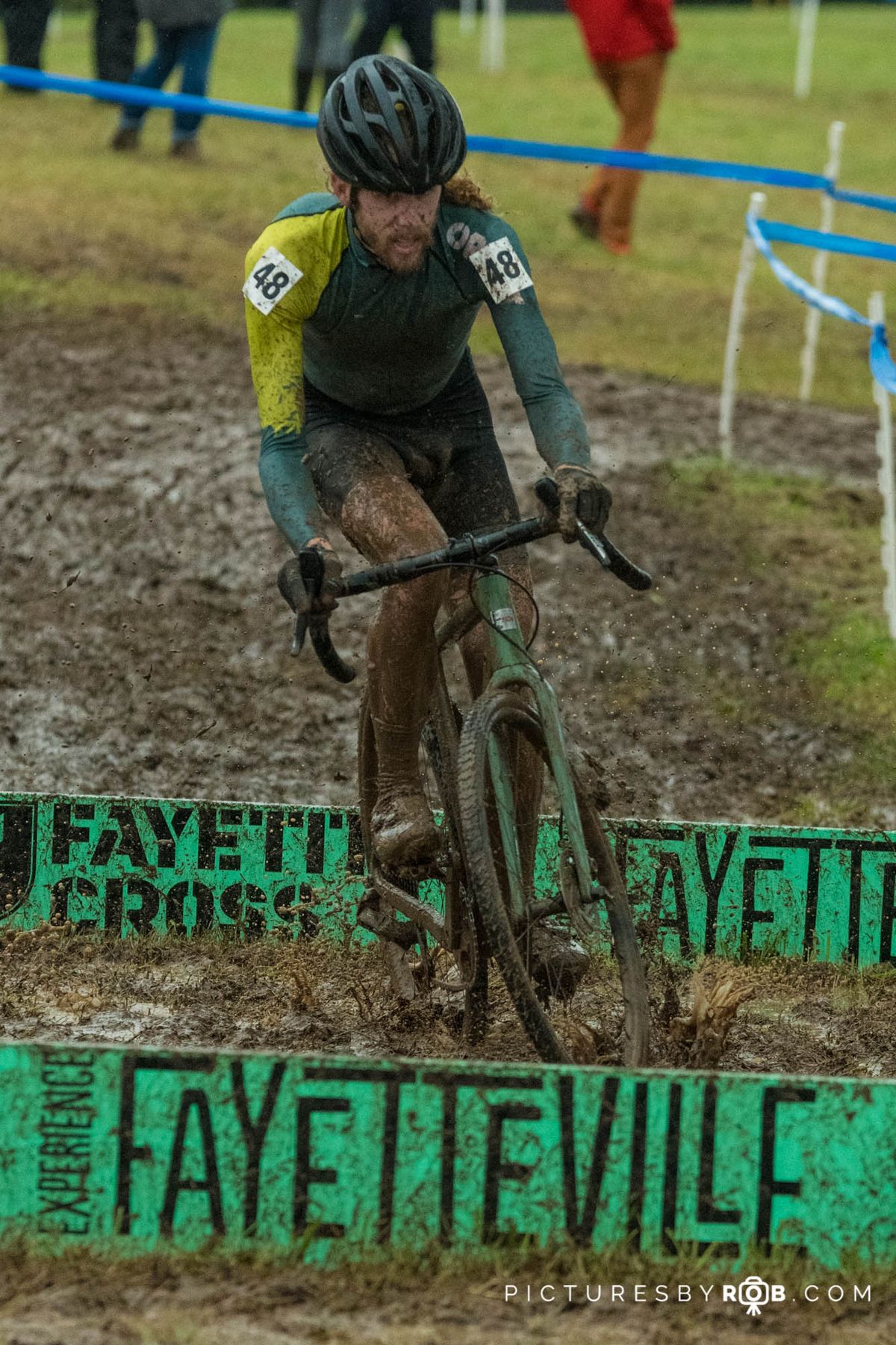 Kyle Johnson (ORNOT x Sahta Cruz) was one of many riders who hopped the barriers in the slick, muddy conditions. And in case you were wondering, he managed not to crash and rode over the 2nd barrier.