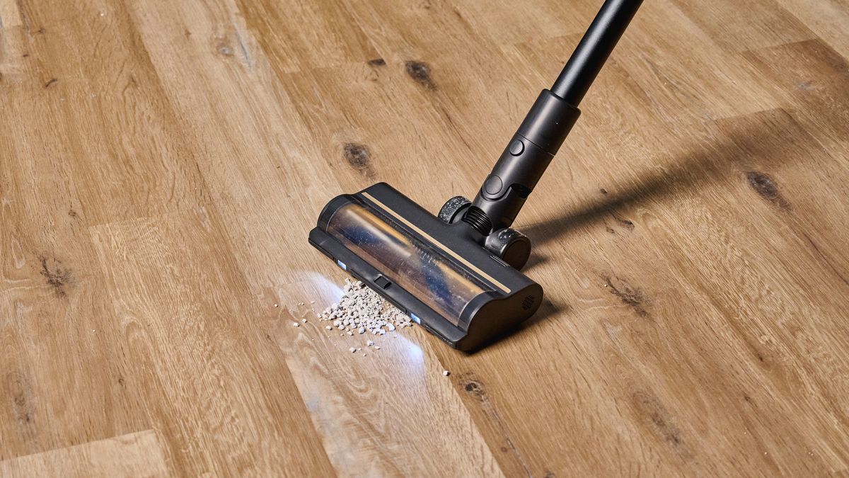 A black and gold Dreame R10 Pro cordless vacuum cleaner