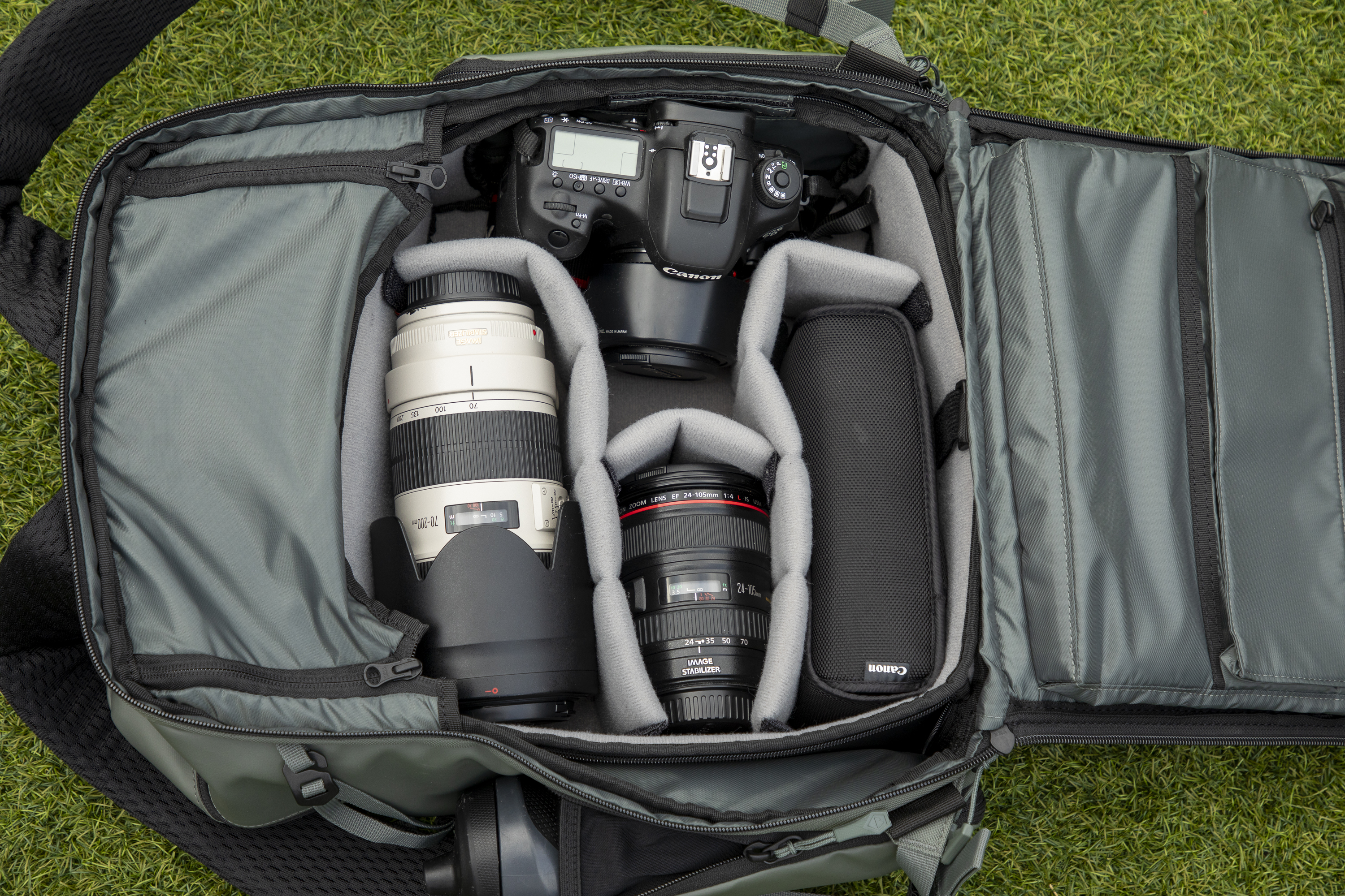 inside a camera backpack with internal dividers, being removed