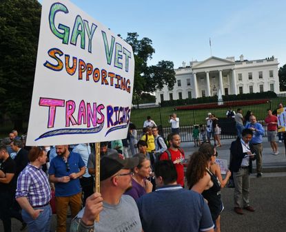 People protest President Trump's prohibition on transgender military recruits