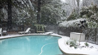 In ground backyard pool in the snow